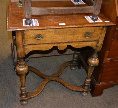 Lot 396 - Reproduction oak lowboy fitted with drawer and wavy shaped stretcher