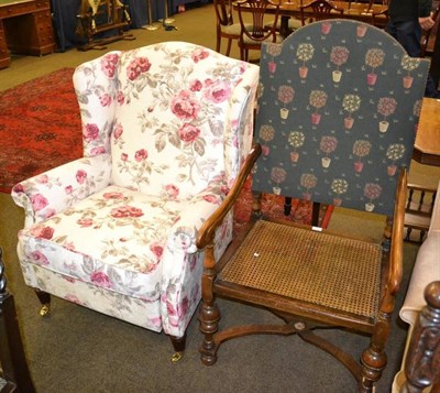 Lot 407 - A Georgian style wing armchair and 17th century style walnut open armchair with caned seat