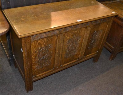 Lot 413 - A 20th century oak linen chest, with three panel moulded front and moulded through stiles