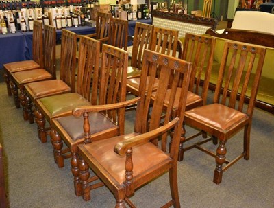 Lot 421 - Set of eleven oak lath back dining chair including two with arms