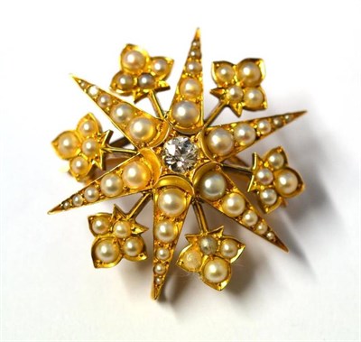 Lot 273 - A Diamond and Pearl Star Brooch/Pendant, an old cut diamond centres six radial arms set with...