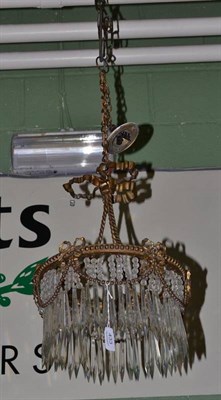 Lot 433 - A gilt metal light fitting with cut prism and bead drops