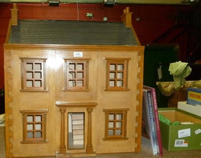 Lot 450 - A Georgian style wooden doll's house, together with a small quantity of furniture and two...