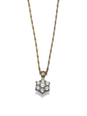 Lot 276 - An 18 Carat Gold Diamond Cluster Pendant on Chain, the pendant comprises seven round brilliant...