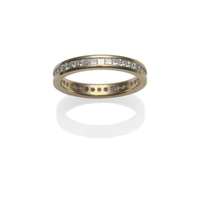 Lot 277 - An 18 Carat Gold Full Eternity Ring, the princess cut diamonds in a yellow flat sided channel...