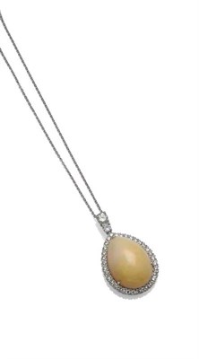 Lot 280 - An 18 Carat White Gold Opal and Diamond Pendant on Chain, the pear shaped cabochon opal within...