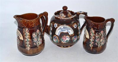 Lot 9 - Measham Bargeware teapot, Mrs Worley, Bingham, Nottshire 1880 and two Measham Bargeware jugs...