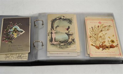 Lot 31 - An album of postcards including photographic, topographical, greetings etc