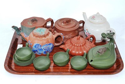 Lot 37 - Four Chinese Yixing redware teapots, a green wine kettle, a Chinese porcelain teapot and four...