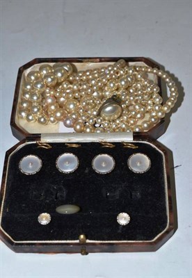 Lot 58 - A cased part dress stud set, with mother-of-pearl and seed pearl centres, and two strands of...