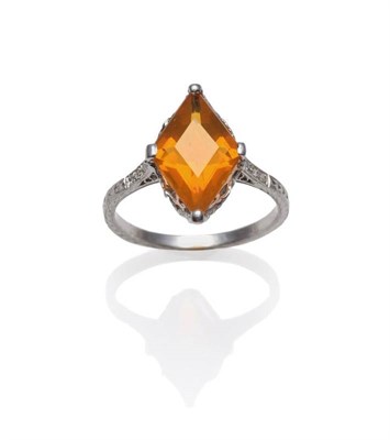 Lot 287 - A Fire Opal and Diamond Ring, the diamond shaped step cut fire opal in white claws on a fancy...