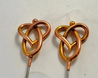 Lot 73 - A pair of hat pins