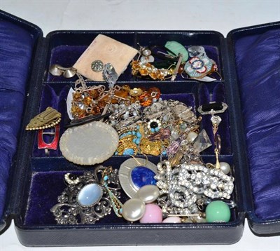 Lot 82 - A box of costume jewellery including paste brooches, an elephant hair ring, a red enamel scarf...