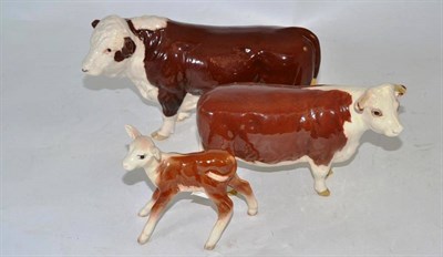 Lot 109 - A Beswick Hereford bull, cow and calf