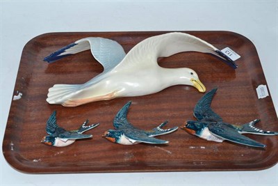 Lot 113 - A Beswick seagull wall plaque 658/1 and three Beswick swallow wall plaques 757 (4)