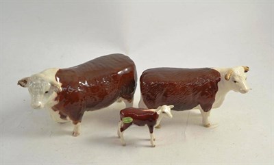 Lot 125 - A Beswick Hereford bull, cow and calf