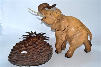 Lot 139 - Large Italian earthenware figure of an African elephant and a large metal pineapple dish