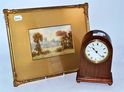 Lot 155 - An Edwardian mahogany mantel timepiece and a watercolour of St Thomas Exter by Henry Sinclair...