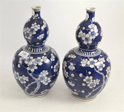 Lot 168 - A pair of Chinese blue and white porcelain double gourd vases