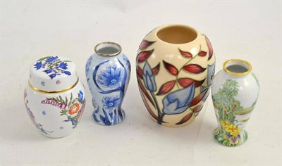 Lot 179 - A Moorcroft vase, two Moorcroft enamel vases and a Moorcroft enamel ginger jar and cover (4)