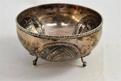 Lot 184 - A Russian silver bowl with repousse decoration depicting a double headed eagle, a fortified...