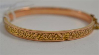 Lot 198 - A 9ct gold half eternity engraved bangle