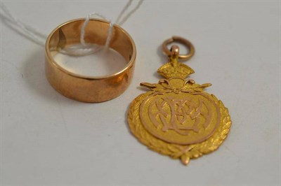 Lot 203 - 9ct gold band ring and a 9ct fob medal