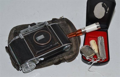 Lot 217 - Cigar cutter, Super Baklina camera, silver holders, etc