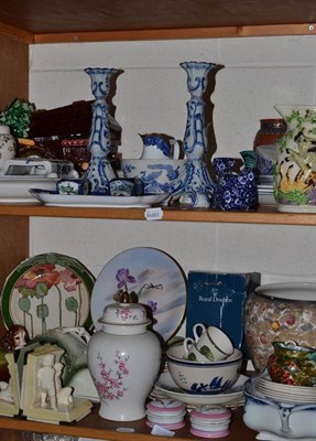 Lot 269 - Two shelves of decorative ceramics including a water wheel clock, Mettlach vase, Royal Doulton...