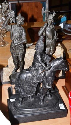 Lot 280 - A pair of bronzed spelter figures on marble plinths and a similar equestrian figure