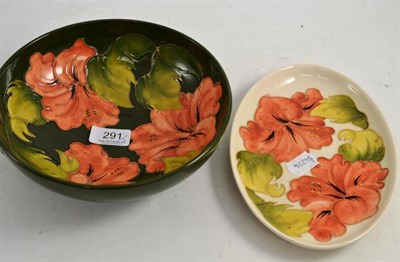 Lot 291 - Moorcroft coral Hibiscus pattern bowl, on a green ground, factory marks and a Moorcroft...