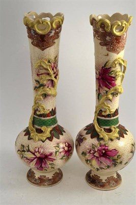 Lot 312 - A pair of Japanese earthenware vases painted with flowers