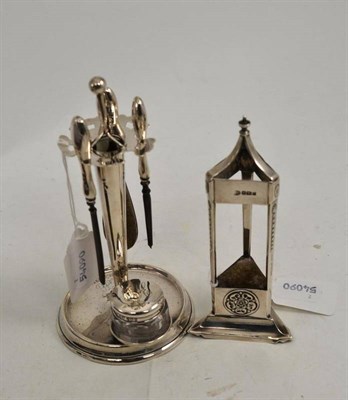 Lot 321 - A silver loaded manicure stand with glass jar and a silver hat pin stand