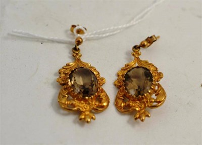 Lot 322 - A pair of 9ct gold smokey quartz earrings