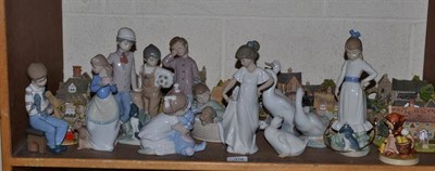 Lot 378 - Fourteen various Nao figures, a Hummel figure 'Chick Girl' and fourteen various Lilliput Lane...