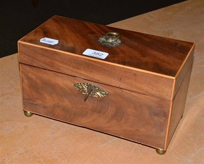 Lot 382 - A George III tea caddy, circa 1790, of rectangular form outlined in boxwood