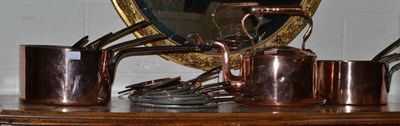 Lot 384 - Nine copper pans and lids, copper kettle, two copper trays