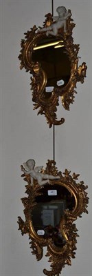 Lot 461 - Pair of gilt Rococo style mirrors surmounted with a Cupid