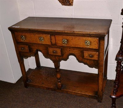 Lot 471 - A Titchmarsh and Goodwin style small oak dresser