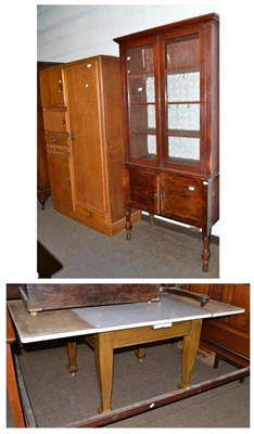 Lot 472 - An oak kitchen pantry cupboard, a wash stand, a kitchen table and a glazed bookcase top