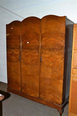 Lot 473 - A walnut triple wardrobe