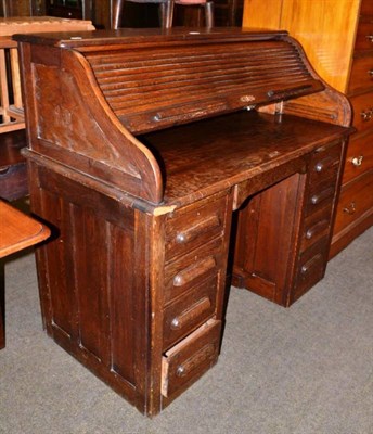 Lot 494 - 1920's/1930's oak roll top desk