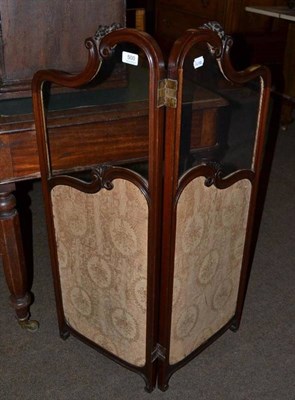 Lot 500 - A glazed mahogany two fold fire screen