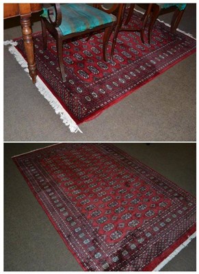 Lot 511 - Two modern red ground rugs, 157 x 251cm and 124 x 198cm