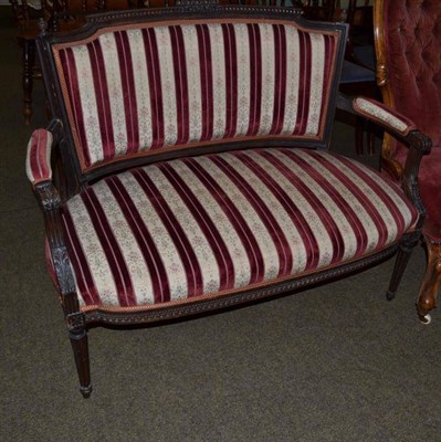 Lot 525 - A carved stained beech framed sofa