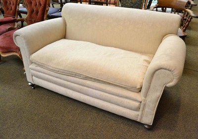 Lot 527 - Victorian two seater cream upholstered drop end sofa