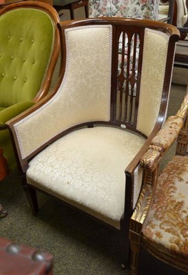 Lot 532 - An Edwardian mahogany tub shaped chair, upholstered in cream brocade