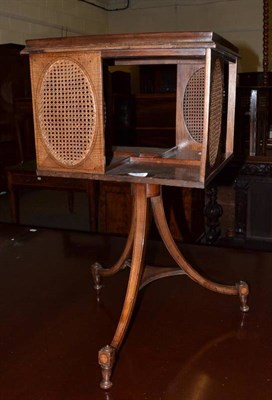 Lot 539 - A 20th century mahogany revolving bookcase on tripod support