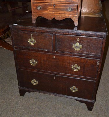 Lot 540 - An 18th century oak dressing chest with two short and two long drawers on bracket feet