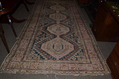 Lot 544 - A Shirvan rug North East Caucasus, the indigo field with a column of serrated medallions...